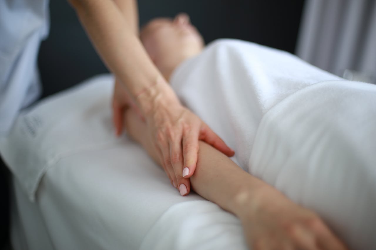 services-01 Close-up of an arm massage promoting relaxation and wellness in a spa environment.